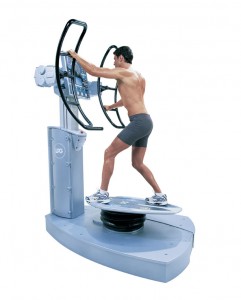 Man using vibration fitness platform machine
