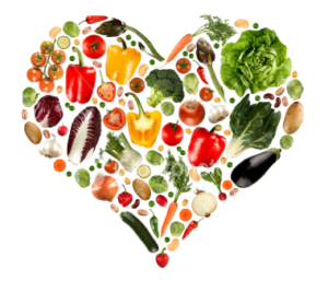 Heart-shaped arrangement of colorful fresh vegetables